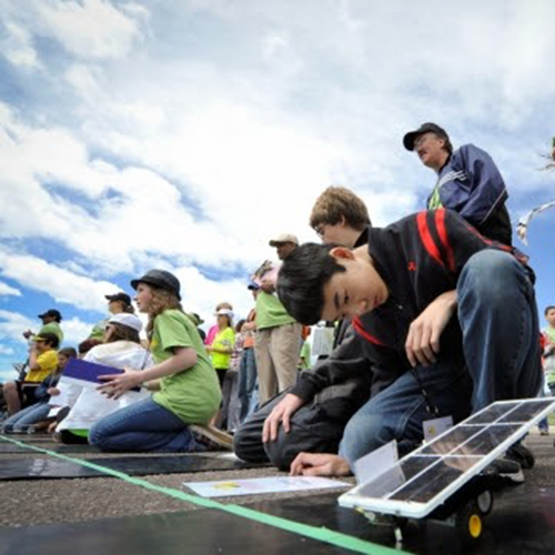 Students test out solar panels.